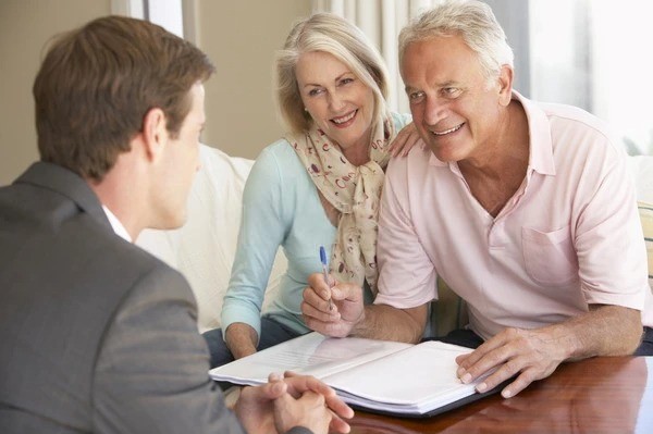 senior couple meeting financial advisor 600w 279906161